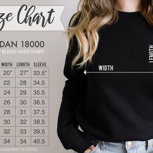 May include: Size chart for Gildan 18000 heavy blend sweatshirt. The chart shows measurements in inches for width, length, and sleeve length for sizes S through 5XL.