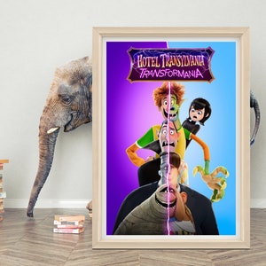May include: A framed movie poster for the animated film "Hotel Transylvania: Transformania". The poster features the main characters from the film, including Dracula, Mavis, Johnny, and Frankenstein, in a colourful and whimsical design.