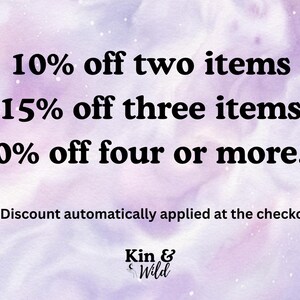 May include: A digital graphic on a light purple watercolor background with black text reading: 10% off two items, 15% off three items, 20% off four or more... Discount automatically applied at the checkout. The logo Kin & Wild is at the bottom.
