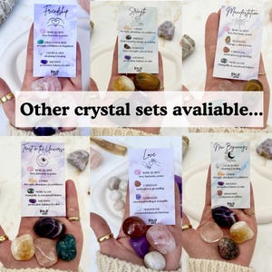 May include: Six sets of polished tumbled crystals, each accompanied by a descriptive information card. The cards feature themes like Friendship, Strength, Manifestation, Trust in the Universe, Love, and New Beginnings, listing specific stones.