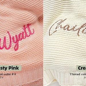 May include: Two knitted blankets, one dusty pink with "Wyatt" embroidered in pink, the other cream with "Charlie" embroidered in brown. The dusty pink blanket has thread color #4 and font F4. The cream blanket has thread color #2 and font F1.