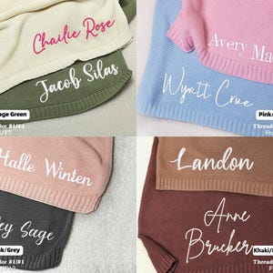 May include: A collection of personalized baby blankets in various colors, including cream, sage green, pink, baby blue, dusty pink, grey, khaki, and dark brown. Each blanket features a name embroidered in white script.