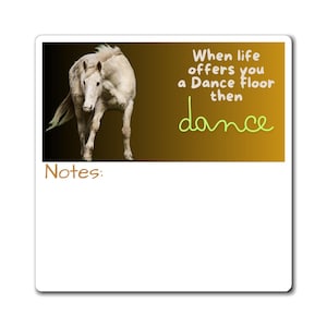 May include: A white horse with a brown mane and tail stands on a brown and black background. The text "When life offers you a Dance floor then dance" is written in white and green letters.