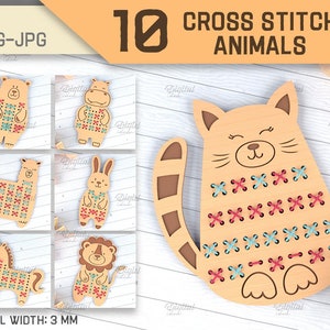 May include: Ten cross stitch animal designs for crafting. The designs include a cat, bear, hippopotamus, hedgehog, llama, rabbit, bull, unicorn, and lion. The designs are on a light brown wooden background with a white grid pattern. The designs are 3 mm thick.