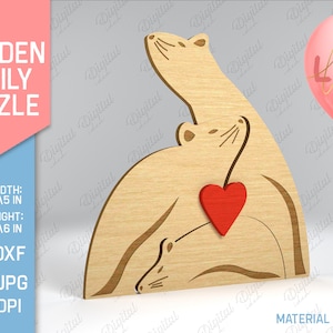 Puede incluir: Puzzle familiar de madera con un corazón y la palabra "LOVE" en un globo rosa. El rompecabezas está hecho de madera y está diseñado para ser cortado y ensamblado. El rompecabezas mide 127 mm de ancho y 153 mm de alto. El ancho del material es de 3 mm.