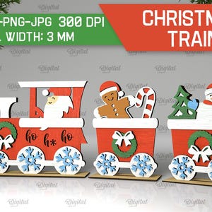 May include: A Christmas train with three cars, each decorated with a different holiday theme. The first car features a Santa Claus, the second car has a gingerbread man, and the third car has a snowman. The train is made of wood and is painted in red, white, and green.