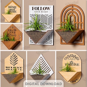 May include: A collection of ten wooden wall planters in various geometric shapes, each holding a small plant. The planters feature inspirational quotes like "Be Kind Be You" and "Follow Your Heart". The material width is 3 mm.