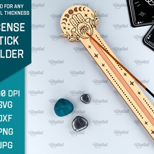 May include: A wooden incense stick holder with a hand and eye design. The holder is decorated with stars and moons. The holder is suitable for any material thickness. 300 DPI SVG, DXF, PNG, JPG.