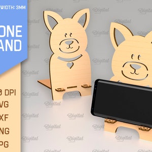 May include: A phone stand made of wood, shaped like a cartoon dog. The stand is 3mm thick and is designed to hold a smartphone upright. The stand is available in SVG, DXF, PNG, and JPG formats.