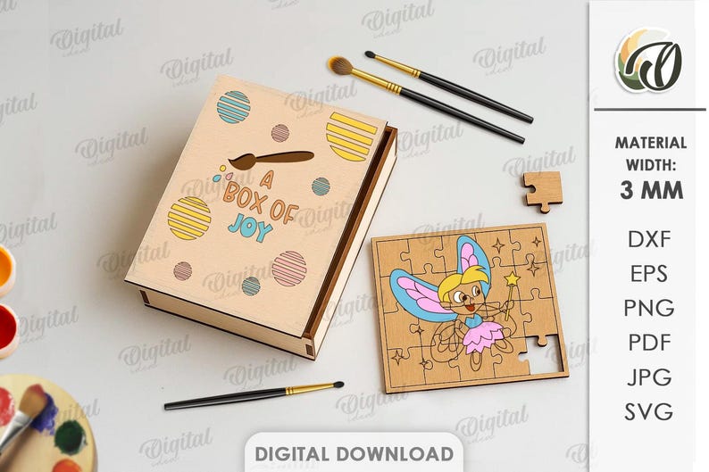 May include: A wooden box with the text "A Box of Joy" and colourful dot designs. A wooden jigsaw puzzle with a fairy illustration is next to the box. Paintbrushes and a paint palette are also visible.