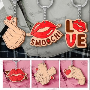 May include: A collection of wooden keychains with various designs, including hands forming a heart, lips with "Smooch!", and the word "LOVE". Some keychains have the text "ILY" and "XOXO". The image also includes the text "10 DESIGNS" and "DIGITAL DOWNLOAD".