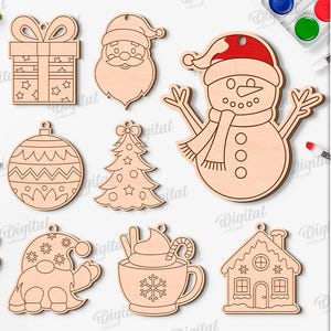 May include: A collection of 10 wooden Christmas ornament designs, including a snowman with a red hat, Santa Claus, a gift, a bell, a Christmas tree, a reindeer, a gnome, a hot chocolate, and a gingerbread house. The text says "10 Designs" and "Suited for any material thickness".
