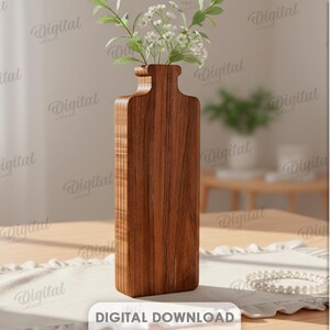 K&ouml;nnte beinhalten: Eine hohe, rechteckige Holzvase mit schmalem Hals, gef&uuml;llt mit wei&szlig;en Bl&uuml;ten und gr&uuml;nen Stielen. Die Vase ist aus dunkelbraunem Holz gefertigt und steht auf einem hellen Tisch. Der Text "DIGITAL DOWNLOAD" ist unten im Bild zu sehen.
