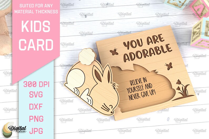 May include: A wooden card with a bunny cutout and the text "You are adorable. Believe in yourself and never give up!"