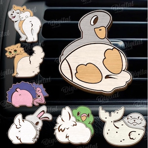 May include: A collection of 10 wooden animal designs, including a cow, dog, cat, hedgehog, hippo, rabbit, bird, and seal. The designs are laser cut with a 3 mm width. The image also includes the text "Digital Download".