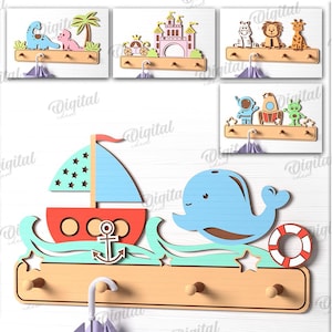May include: Ten different designs for wooden coat racks with various themes, including a sailboat, a whale, a castle, a bus, a rocket, and a dinosaur. Each design features a colorful, whimsical illustration and three hooks for hanging coats, hats, or bags. The designs are suitable for any material thickness.