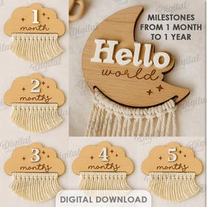 May include: Wooden milestone plaques in cloud shapes, numbered from 1 to 11 months and "One year". A wooden moon with "Hello world" text and macrame fringe is also shown. The image also includes text: "Milestones from 1 month to 1 year".