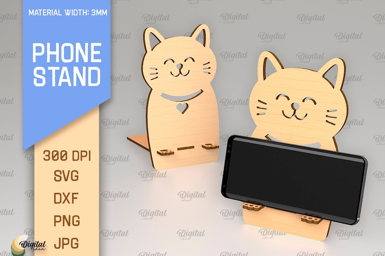 May include: A wooden phone stand shaped like a cat with a smiling face. The stand is 3mm thick and is designed to hold a smartphone upright. The stand is made of wood and has a natural finish.