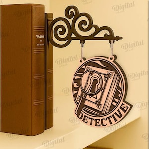Peut inclure: Un panneau de d&eacute;tective en bois avec une loupe et un trou de serrure est suspendu &agrave; un support d&eacute;coratif. Le panneau indique "DETECTIVE" et est suspendu devant deux livres bruns. Convient &agrave; toutes les &eacute;paisseurs de mat&eacute;riaux.
