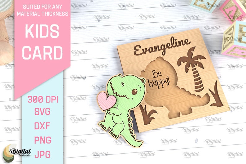 May include: A wooden card with a green dinosaur holding a pink heart. The card says "Evangeline" and "Be happy!" in a brown font.