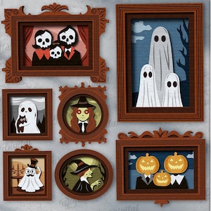 May include: Ten Halloween-themed designs displayed in decorative brown frames. The designs feature a black cat, a skull family, ghosts, a witch, and pumpkins. Text includes "10 Designs" and "Digital Download".