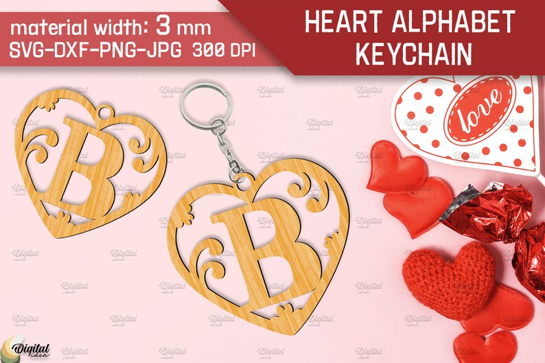 May include: A wooden heart-shaped keychain with a decorative letter B inside. The keychain is made of light brown wood and has a silver ring for attaching keys. The background is pink.