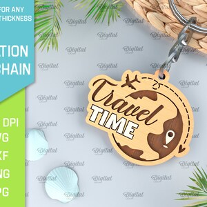 May include: A wooden keychain with a globe design and the text "Travel Time" in white lettering. The keychain is attached to a silver key ring.