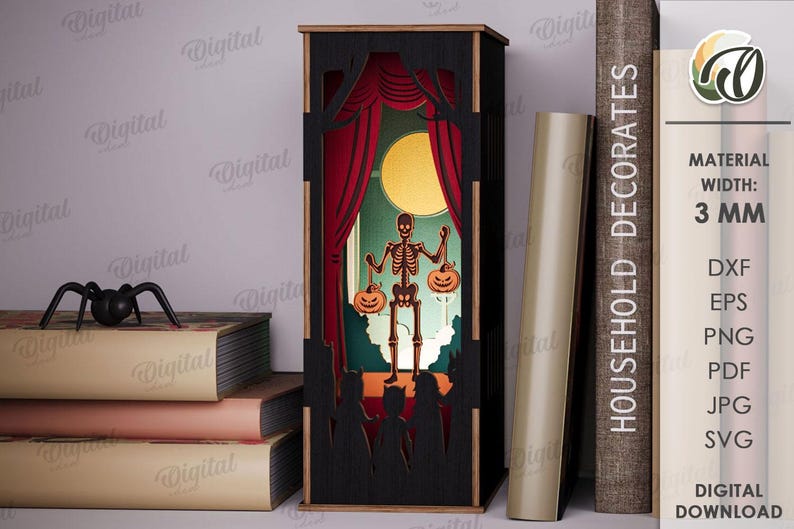 May include: A black Halloween-themed shadow box with a skeleton holding jack-o'-lanterns on a stage with red curtains and a full moon. A black spider sits on a stack of books. The text "HOUSEHOLD DECORATES" is on a book.