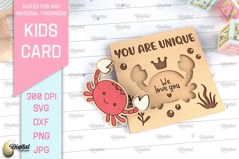 May include: A wooden card with a crab design and the text "You are unique. We love you." The card is light brown with a red crab and white accents.