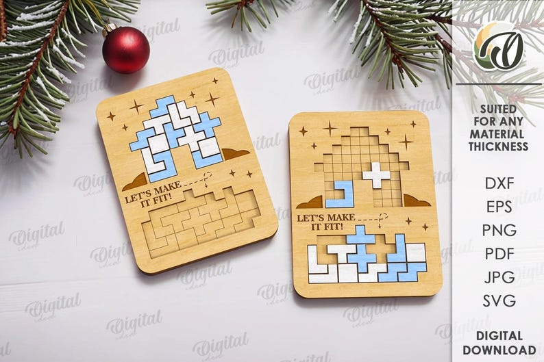 May include: Two wooden puzzle game pieces with a Tetris-like design, featuring blue and white blocks. The phrase "LET'S MAKE IT FIT!" is printed on each piece. A red ornament and evergreen branches are in the background. Digital download.