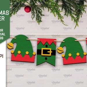 May include: A Christmas banner with five green elf hats with red and yellow accents. The banner is strung with twine and is ready to be hung.