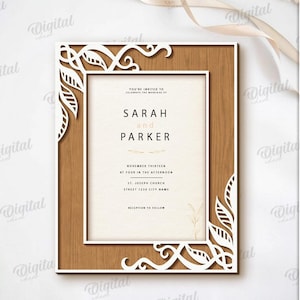 May include: A laser-cut wedding invitation with a wooden frame and white leaf accents. The invitation reads "SARAH and PARKER" with event details. The design is suitable for any material thickness and available in DXF, EPS, PNG, PDF, JPG, and SVG formats.
