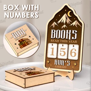 May include: Wooden book-themed decor with the text "BOX WITH NUMBERS" and "BOK FOR NUMBERS". The main piece is a book-shaped counter with the text "BOOKS READ THIS YEAR" and numbers 156. The design includes mountains and a moon.