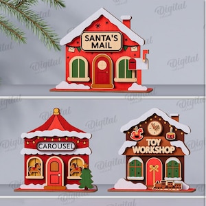May include: Three wooden Christmas house designs. The first is a red house with "SANTA'S MAIL" on the roof. The second is a carousel, and the third is a "TOY WORKSHOP". The material width is 3 mm.