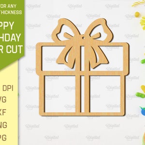 May include: A laser cut design of a gift box with a bow on top. The design is suitable for any material thickness. The image includes the text "Happy Birthday Laser Cut".