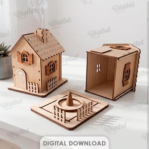 Può includere: Un kit brucia incenso a forma di casa in legno tagliato al laser con uno spessore del materiale di 3 mm. Il set include una struttura a casa con camino, una base separata con porta cono e recinzione, e una sezione di casa aperta. Testo: MATERIAL WIDTH: 3 MM.