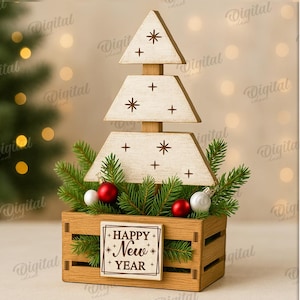 May include: Wooden Christmas tree decoration with a Happy New Year sign. The tree is made of three stacked, cream-colored, triangular pieces with star and cross cutouts. It sits in a wooden crate with greenery and red and silver ornaments. The material width is 3 mm.
