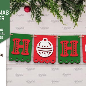 May include: A red and green Christmas banner with the words "HO HO" and ornaments. The banner is made of paper and has a scalloped edge.