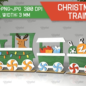 May include: A Christmas train made of wood with a green and white color scheme. The train has three cars, the first car features a reindeer, the second car has presents, and the third car has Christmas ornaments. The train is 3 mm wide.