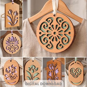May include: A collection of ten wooden laser cut designs, including floral and geometric patterns, displayed on hangers. The designs are in various shapes, including circles and rectangles, with intricate cut-out details. The text "DIGITAL DOWNLOAD" is visible.