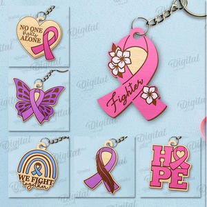 May include: A collection of ten wooden keychains in various designs, including ribbons, butterflies, and hearts. The keychains feature colors like pink, blue, and purple, with text such as "Fighter" and "Hope". The keychains are suitable for any material thickness.