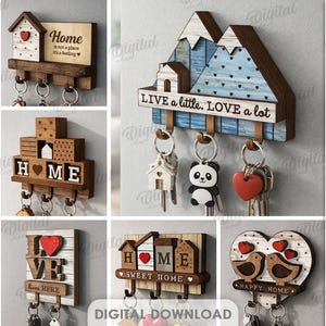 Könnte beinhalten: Eine Sammlung von zehn hölzernen Schlüsselhaltern in verschiedenen Designs. Die Schlüsselhalter zeigen Haus-, Berg- und Herzformen mit Sätzen wie "Home" und "Live a little. Love a lot." Die Schlüsselhalter bestehen aus 3 mm dickem Material.