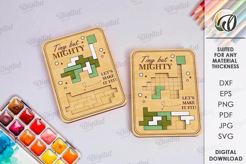 May include: Two wooden puzzle pieces with the text "Tiny but Mighty" and a pixelated design. The pieces have a light brown color with green and white accents. The text "Let's make it fit!" is also included.