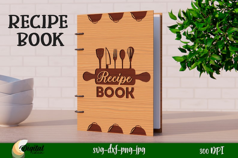 Może przedstawiać: Drewniana książka kucharska z brązowym wałkiem do ciasta i przyborami kuchennymi. Książka ma tytuł "Recipe Book".