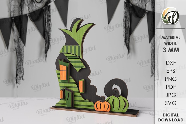 May include: A wooden Halloween decoration depicting a witch's hat, a house with orange windows, and two pumpkins. The decoration is made of layered wood and painted in green, black, and orange. The width is 3 mm.