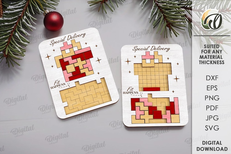 May include: Two wooden puzzle pieces with a Tetris-like design in red, pink, and tan colors. The words "Special Delivery" and "Fit Happens" are printed on the pieces. A red Christmas ornament and pine branches are in the background.