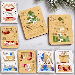 Puede incluir: Una colección de diez diseños de rompecabezas de madera, cada uno con una imagen pixelada única y la frase "Let's Make It Fit!". Los diseños incluyen un árbol de Navidad, un corazón y otras formas. El texto "Tiny but Mighty" también es visible.
