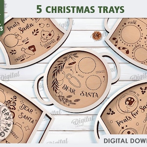 May include: Five wooden Christmas trays with cut-out designs. The trays feature various Christmas themes, including "Treats for Santa", "Dear Santa", and "Drink Me".