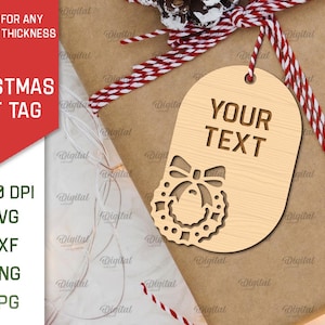 May include: A wooden Christmas gift tag with a wreath design and the text "YOUR TEXT".