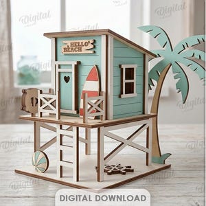 May include: A wooden beach house model with light blue walls, a white ladder, and a white railing. It features a surfboard, a life ring, a ship wheel, and a palm tree. A sign reads HELLO BEACH. The material width is 3 mm, and it is a digital download.